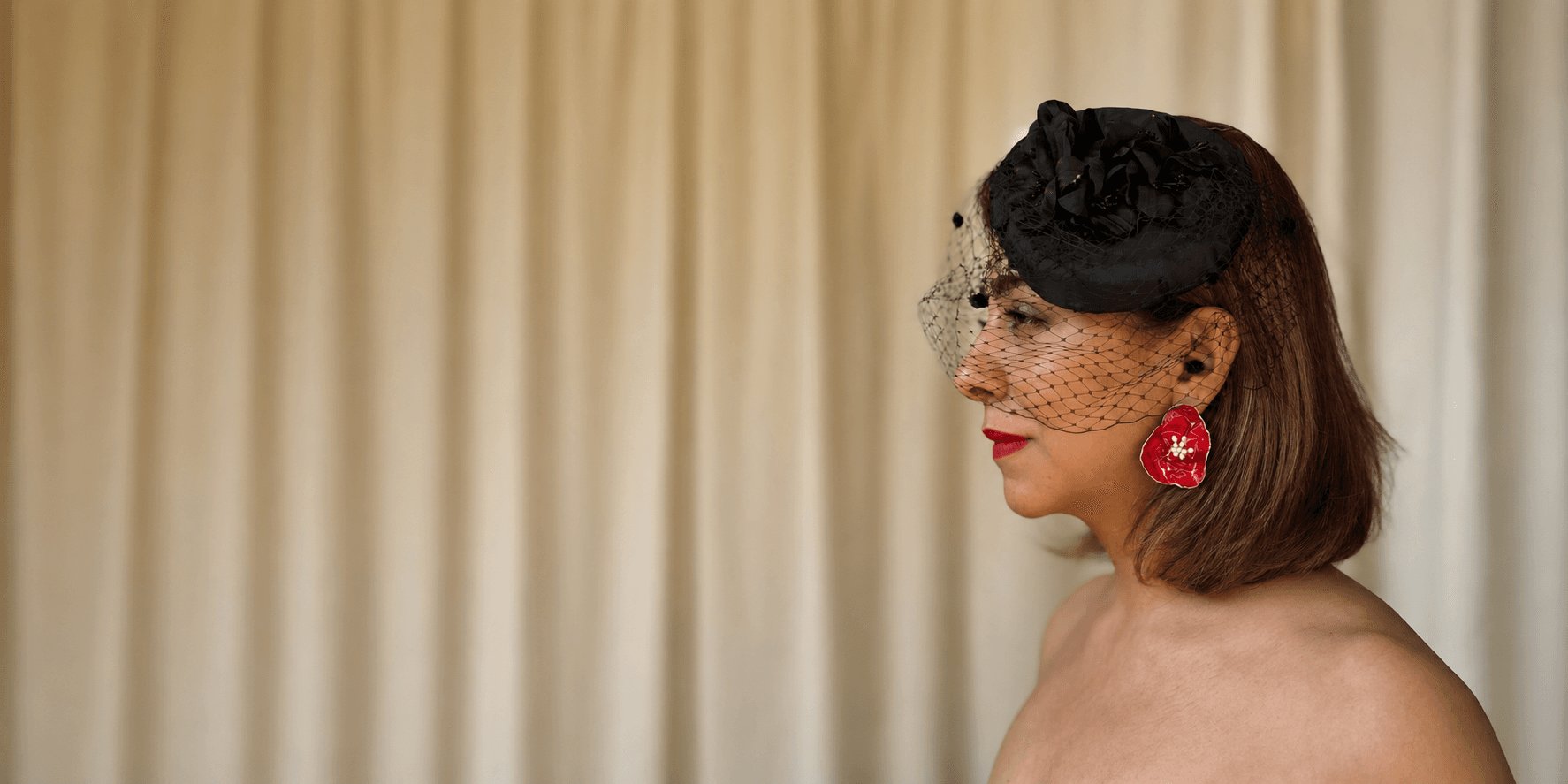 Sara Idee wearable paper jewelry — handcrafted earring campaign portrait